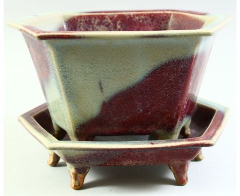 A CHINESE JUN WARE HEXAGONAL POTTERY PLANTER AND TRAY, the planter with pierced base and raised on six feet, planter 25cm lon