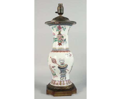 A LARGE CHINESE FAMILLE ROSE PORCELAIN VASE LAMP, the body painted with potted flowers, vases and jardinieres with other obje