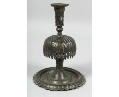 AN 18TH/19TH CENTURY PERSIAN QAJAR CANDLESTICK, 19cm high.