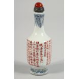 A CHINESE PORCELAIN SNUFF BOTTLE AND STOPPER, the body with calligraphy, the stopper inset with a