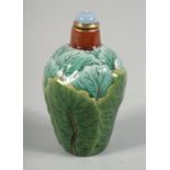 A CHINESE PAK CHOI FORMED PORCELAIN SNUFF BOTTLE AND STOPPER, the base with four-character mark, 7.