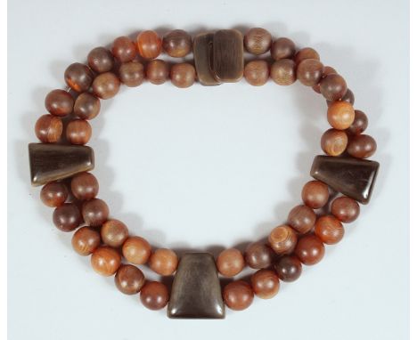 AN ANTIQUE RHINO HORN BEADED NECKLACE.**Please note:&nbsp; this item can only be sold within the UK**