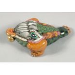 A CHINESE AQUATIC BEAST FORMED PORCELAIN SNUFF BOTTLE AND STOPPER, the base with four-character