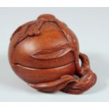 A CHINESE CARVED HARDWOOD PEACH FORM BOX AND COVER, with carved and pierced branch to the base, 13cm
