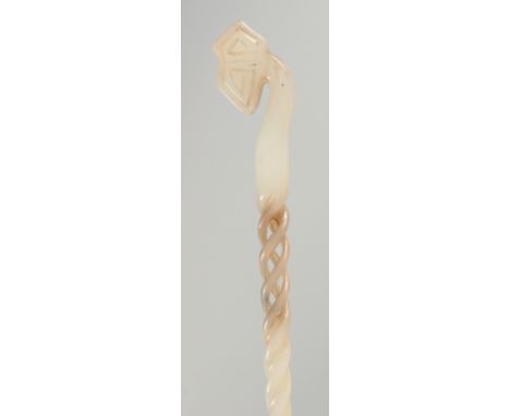 A CHINESE CARVED AND PIERCED JADE HAIR PIN, 23.5cm long.