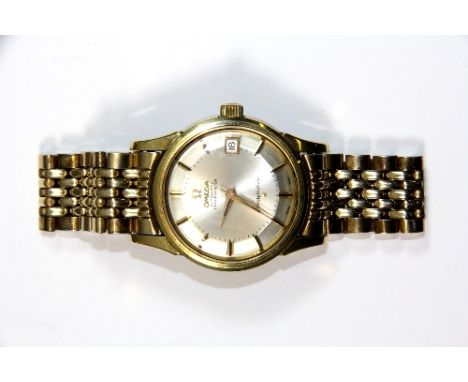 A gents vintage gold plated Omega Constellation automatic wristwatch on a gold plated Omega strap