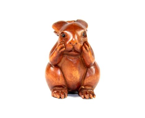 Carved fruitwood netsuke of a rabbit with black onyx eyes