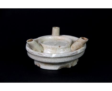 An early Chinese cream glazed porcelain oil lamp, Diam: 9cm