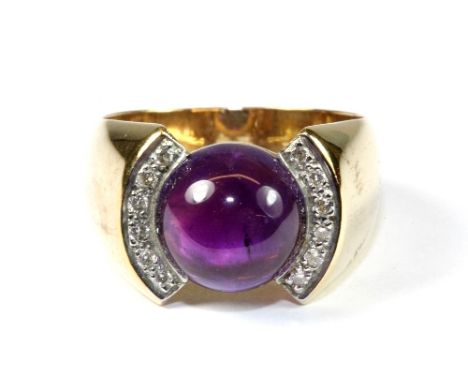 An unusual 9ct yellow gold cabochon amethyst and diamond ring (P.5)