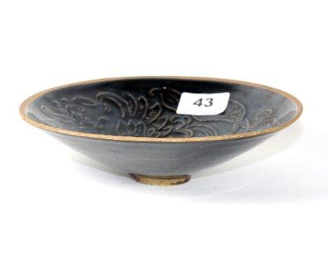 A lovely Chinese relief decorated and black glazed porcelain bowl