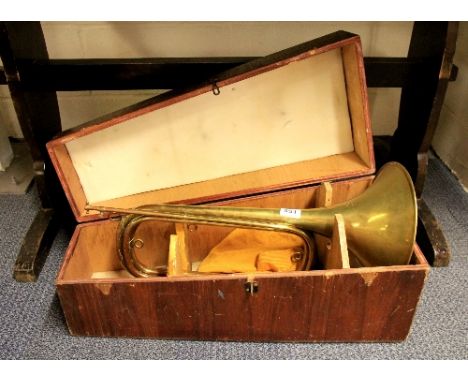 Cased French brass hunting horn by Couesnon, PARIS