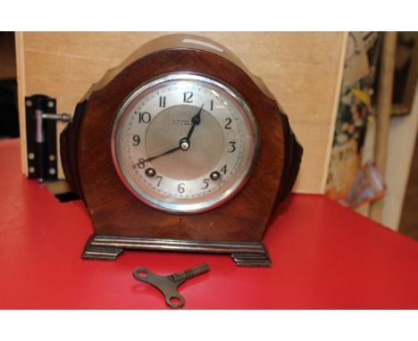 A Art Deco period wooden cased mantle clock, Leeds Maker 