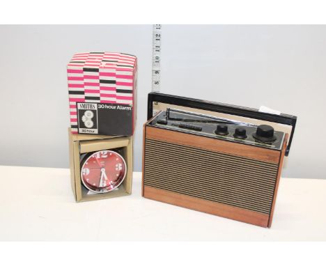 A vintage portable radio and a Smiths 30 hour alarm clock 