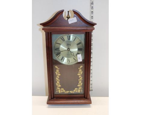 A battery powered wall clock, Postage unavailable 