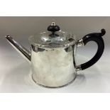EDINBURGH: An 18th Century Scottish silver teapot with crested decoration.