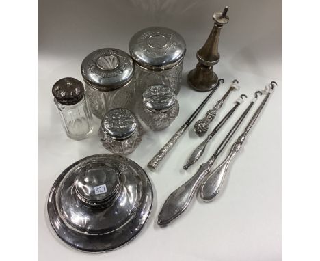 A heavy silver capstan shaped inkwell together with hobnail top jars etc. Est. £20 - £30.