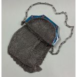 A silver and enamelled purse bearing import marks.