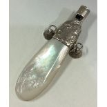 A silver and MOP rattle.