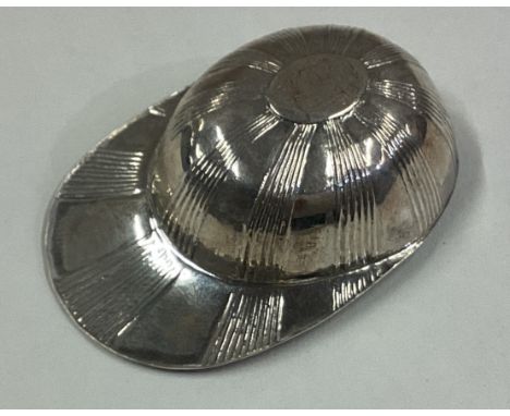 A George III silver caddy spoon in the form of a jockey cap. Marked with lion and King's head. Circa 1800. Approx. 8 grams. E