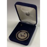 A cased silver money clip.