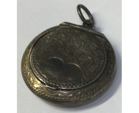 A silver hinged compact with engraved decoration. Birmingham 1913. By ALLD. Approx. 10 grams. Est. £20 - £30.
