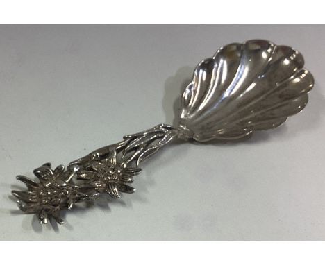 A Continental silver caddy spoon with pierced handle. Approx. 10 grams. Est. £20 - £30.