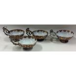 A set of four silver mounted cups with pierced handles.