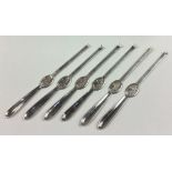 A set of six silver plated lobster picks.