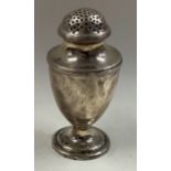 A George III silver caster.