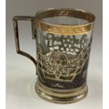 A Russian silver and Niello tea glass holder with glass liner.