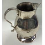 A good heavy silver cream jug in the Georgian style.