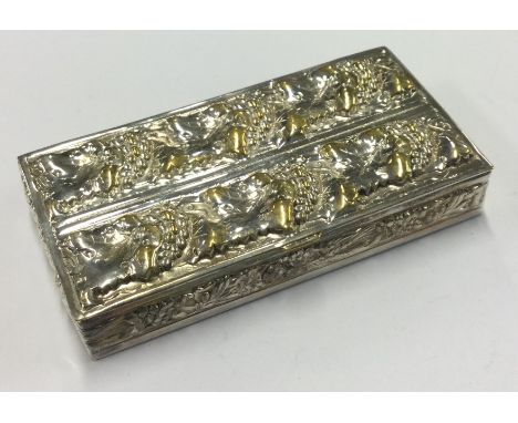 A heavy silver and parcel-gilt snuff box embossed with vines. Approx. 75 grams. Est. £80 - £120.
