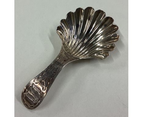A good fluted silver caddy spoon with engraved decoration. London. Approx. 5 grams. Est. £30 - £50.