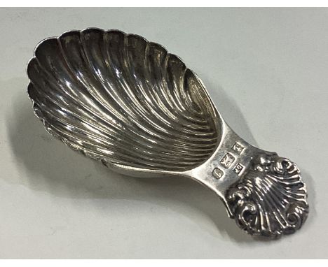 A fluted silver caddy spoon. Birmingham 1980. Approx. 23 grams. Est. £20 - £30.