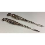 Two silver handled picks.