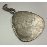 A silver mounted mirror with figural handle.
