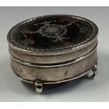 A silver and tortoiseshell jewellery box.