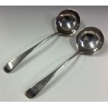 A pair of Georgian silver sauce ladles.