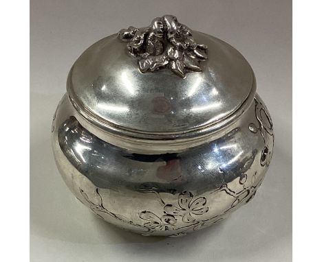 A 19th Century Continental silver tea caddy with chased decoration. Approx. 118 grams. Est. £120 - £150.