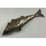 An articulated silver figure of a fish.