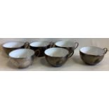 A cased set of six silver teacups.
