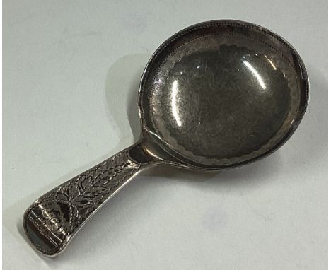 A George III silver caddy spoon with bright-cut decoration. Birmingham 1812. By Cocks & Bettridge. Approx. 3 grams. Est. £60 