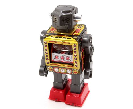 A Horikawa of Japan 1970's vintage battery powered Attacking Martian Robot comprising a gold &amp; grey tinplate body with de