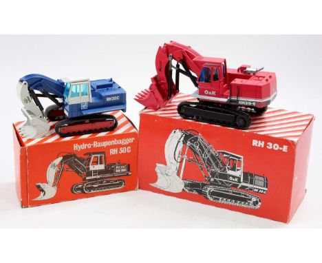 An NZG boxed O&amp;K 1/50 scale diecast group to include a No. 412 O&amp;K RH30-E mining shovel together with a No. 246 RH30-