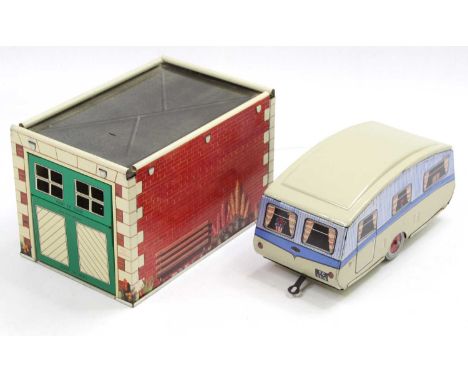 A Mettoy tinplate bump-to-open single door garage with bump-to-open single door mechanism, brickwork lithograph body with int
