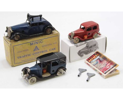 Triang Minic tinplate and clockwork group of 3 comprising No. 39M Pre-war Taxi, blue body with black wings and roof, Shell pe