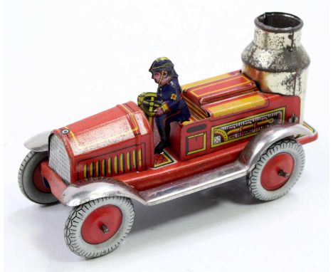 A Distler of Germany tinplate and clockwork steam fire engine comprising a red and yellow printed body, unpainted wings and r