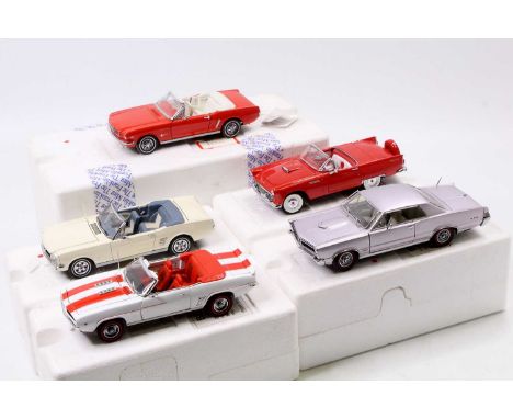 Five Franklin and Danbury Mint 1/24 scale vehicles to include a 1965 Pontiac GTO, a 1969 Chevrolet Camaro, a 1964 Half Mustan