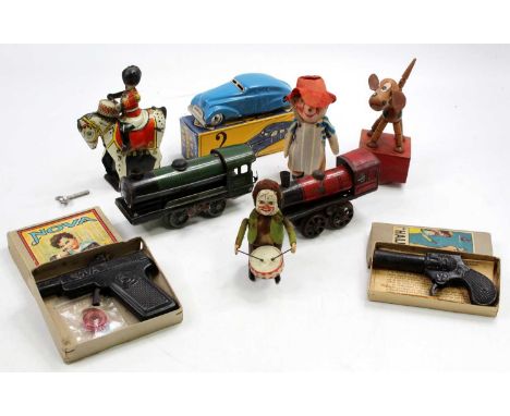 One tray containing a quantity of mixed tinplate and novelty toys to include a tinplate Wonder Car, a Shuco drumming monkey, 