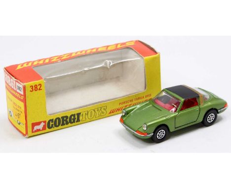 A Corgi Toys No. 382 Porsche Targa 911S finished in metallic green with red interior and black roof, in the original orange a